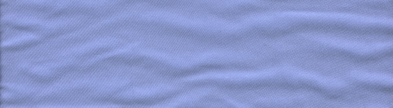 A piece of lavender-colored fabric with a weave that appears to go in a diagonal direction. The bottom and sides are straight lines. The top is an undulating curve.