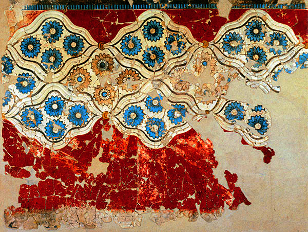 Rosettes on fresco at Akrotiri. Blue rosettes are arranged in groups of 4 within a white ground on a red wall.